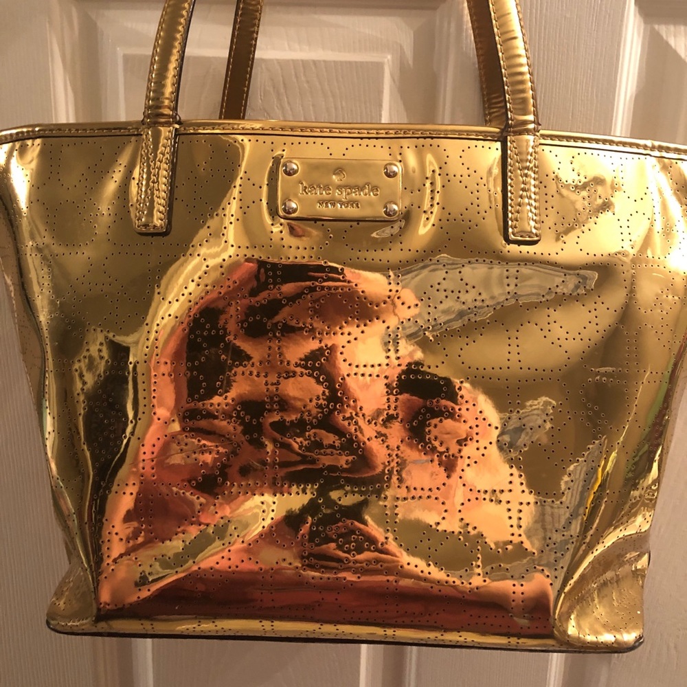 large gold Kate Spade purse